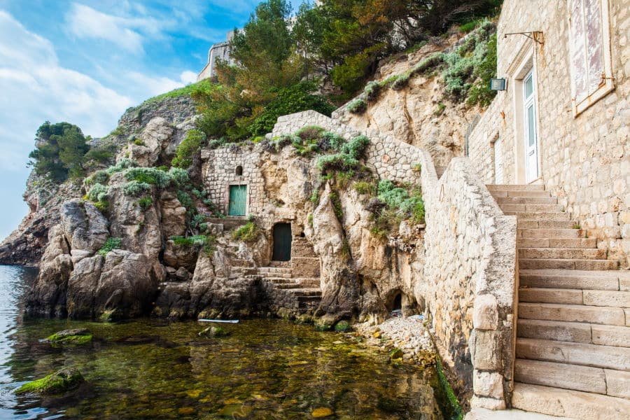 Dubrovnik West Pier and the medieval Fort Lovrijenac located on the western wall of the city