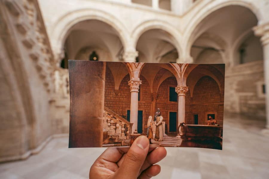 Dubrovnik, Croatia – Aug 22, 2020: GoT TV scene photo held in hand at shot scene inside Rectors palace